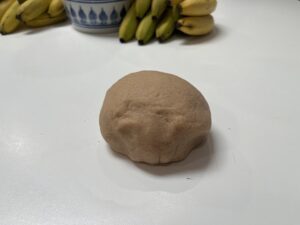A ball of homemade Play-Dough ready to be coloured with food colouring